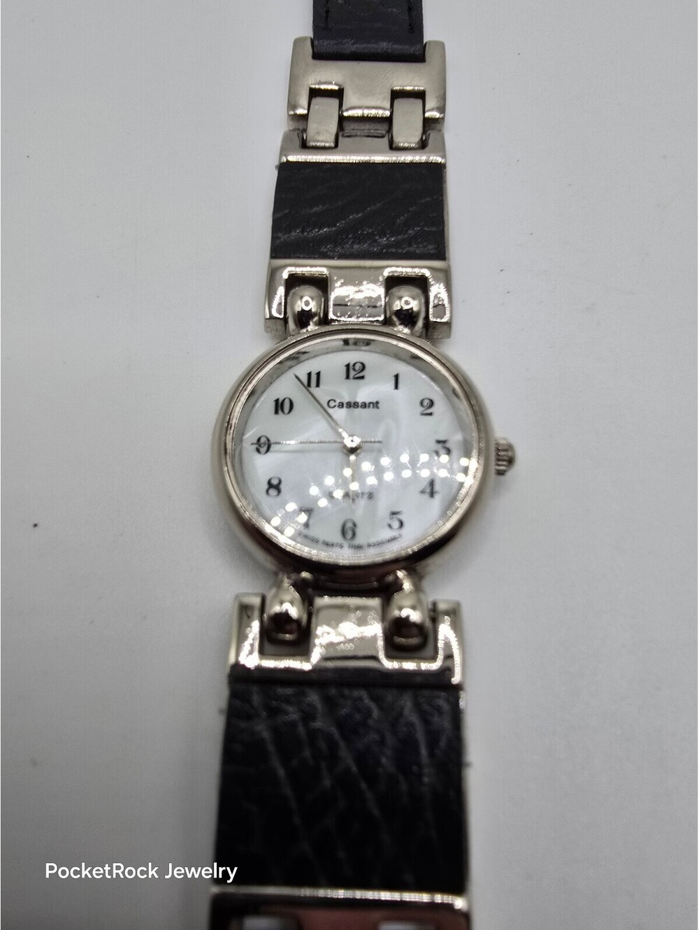 Cassant Women’s Quartz Analog White Dial Arabic Silver Case Black Leather